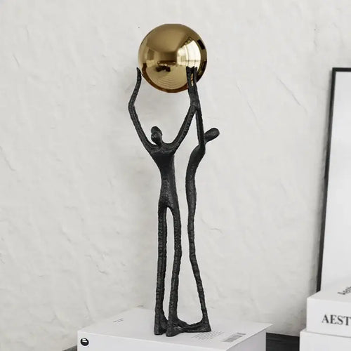 Abstract black and gold human figurine golden ball holder living room