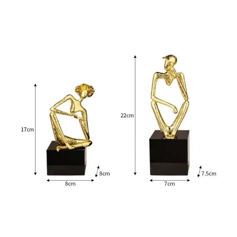 Abstract golden hat thinker figure living room gold & black decor