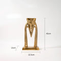 Abstract golden masked figure sculpture living room decor