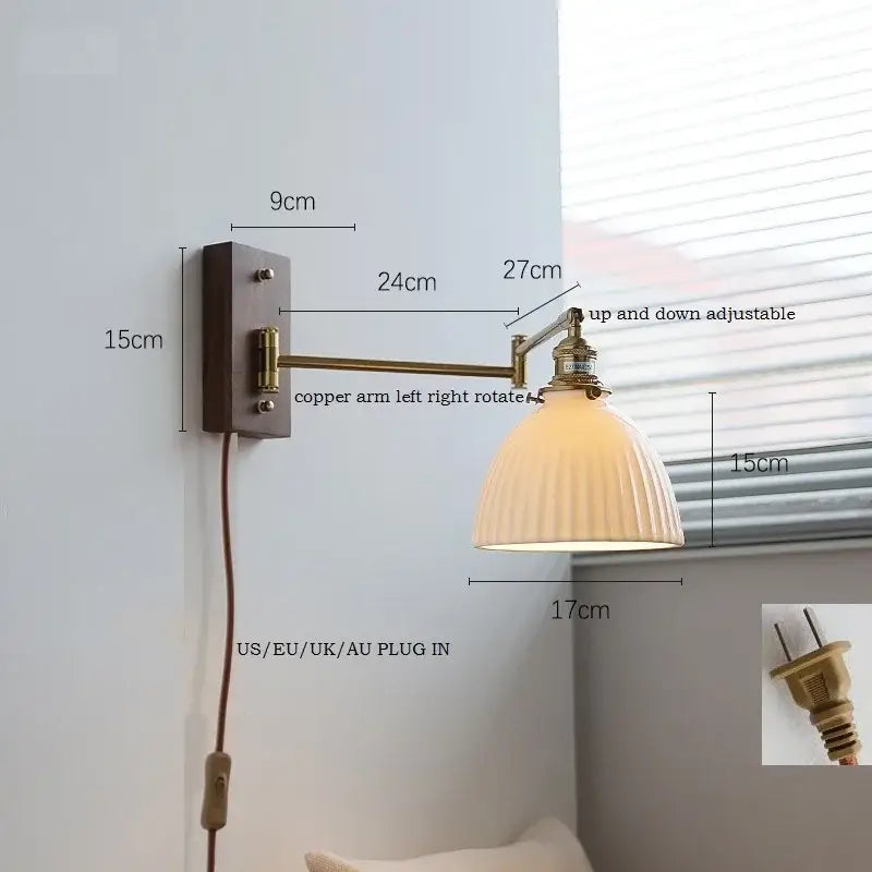 Adjustable brass wall sconce with ribbed glass shade bedroom light