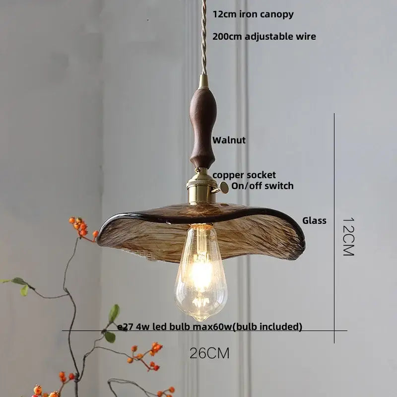 Amber glass pendant light with brass knob switch for dining room