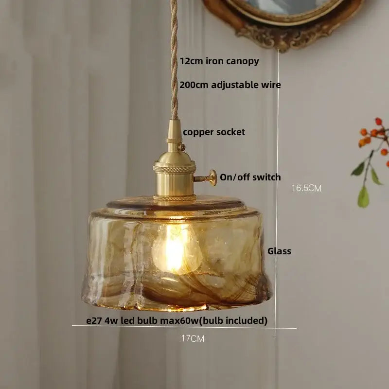 Amber glass pendant light with brass knob switch for dining room