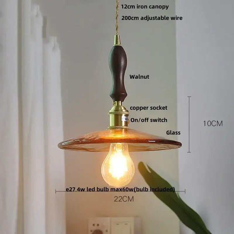 Amber glass pendant light with brass knob switch for dining room