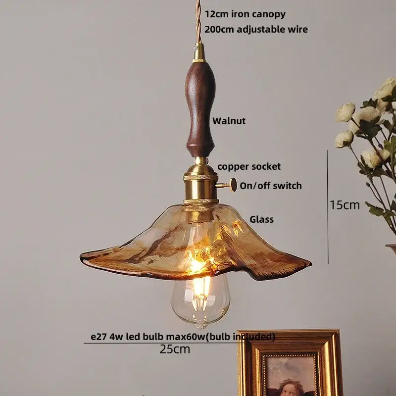 Amber glass pendant light with brass knob switch for dining room