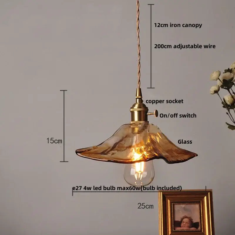 Amber glass pendant light with brass knob switch for dining room