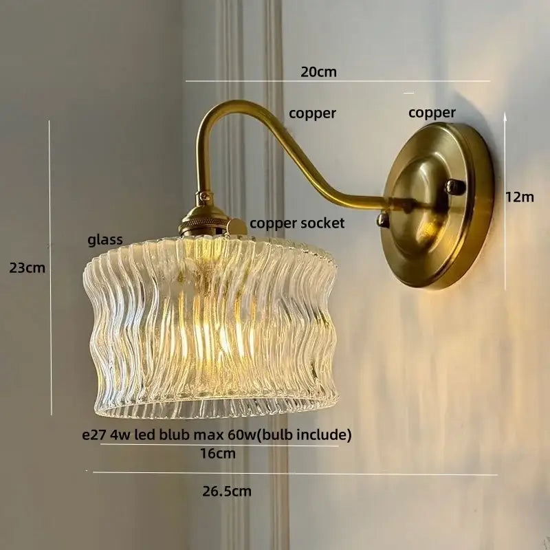 Antique brass and clear glass wall sconce bedroom light