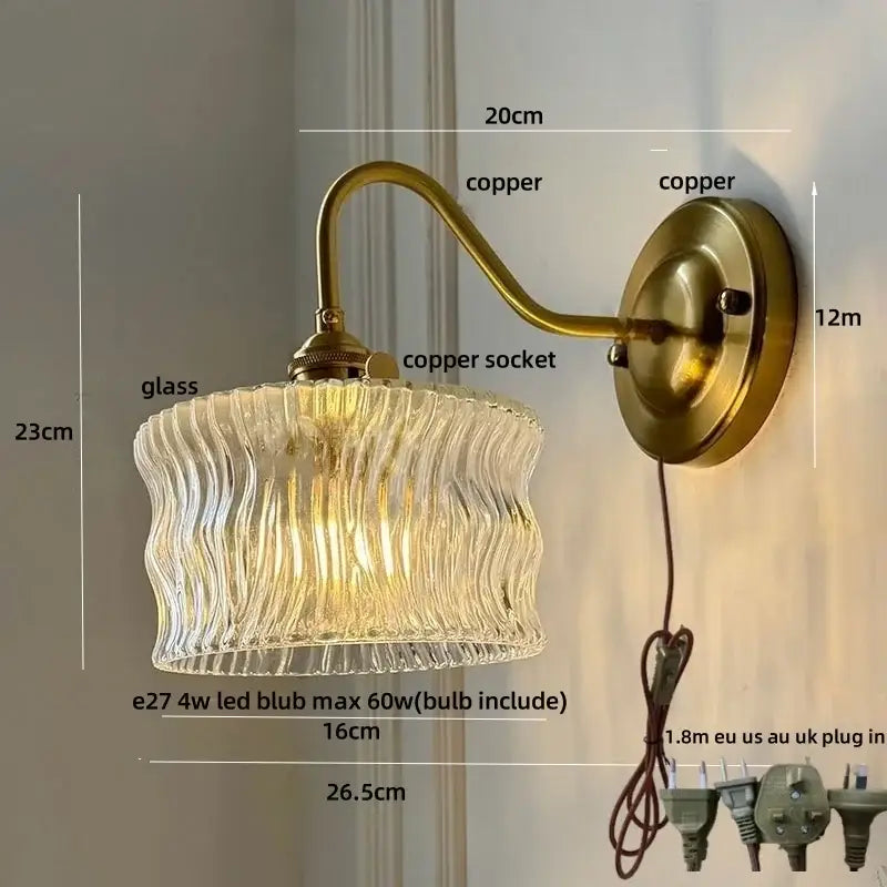 Antique brass and clear glass wall sconce bedroom light