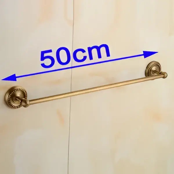 Antique brass single towel bar with ornate base for bathroom decor