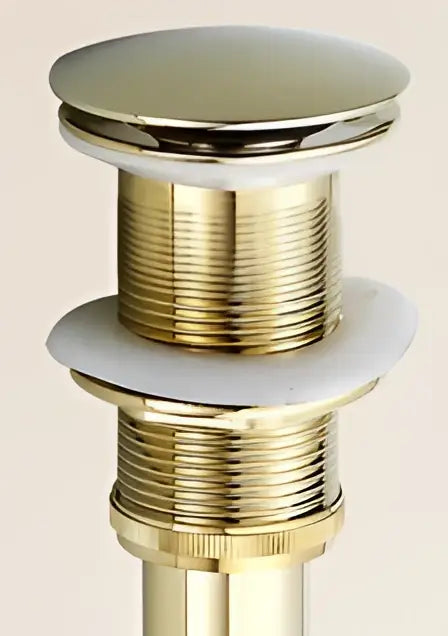 Antique brass sink drain with white rubber seal – bathroom waste