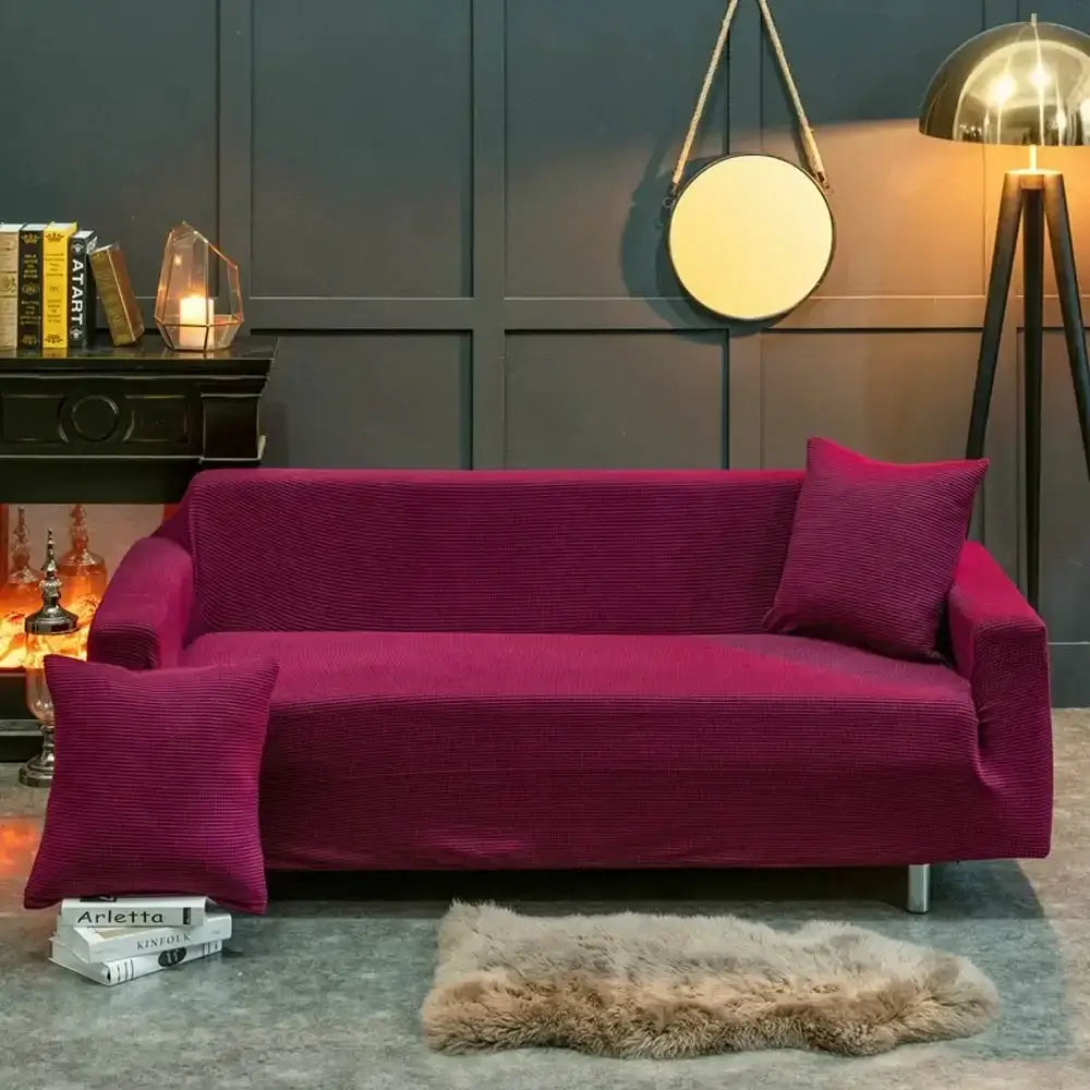 Beige textured quilted sofa cover with pillows for living room