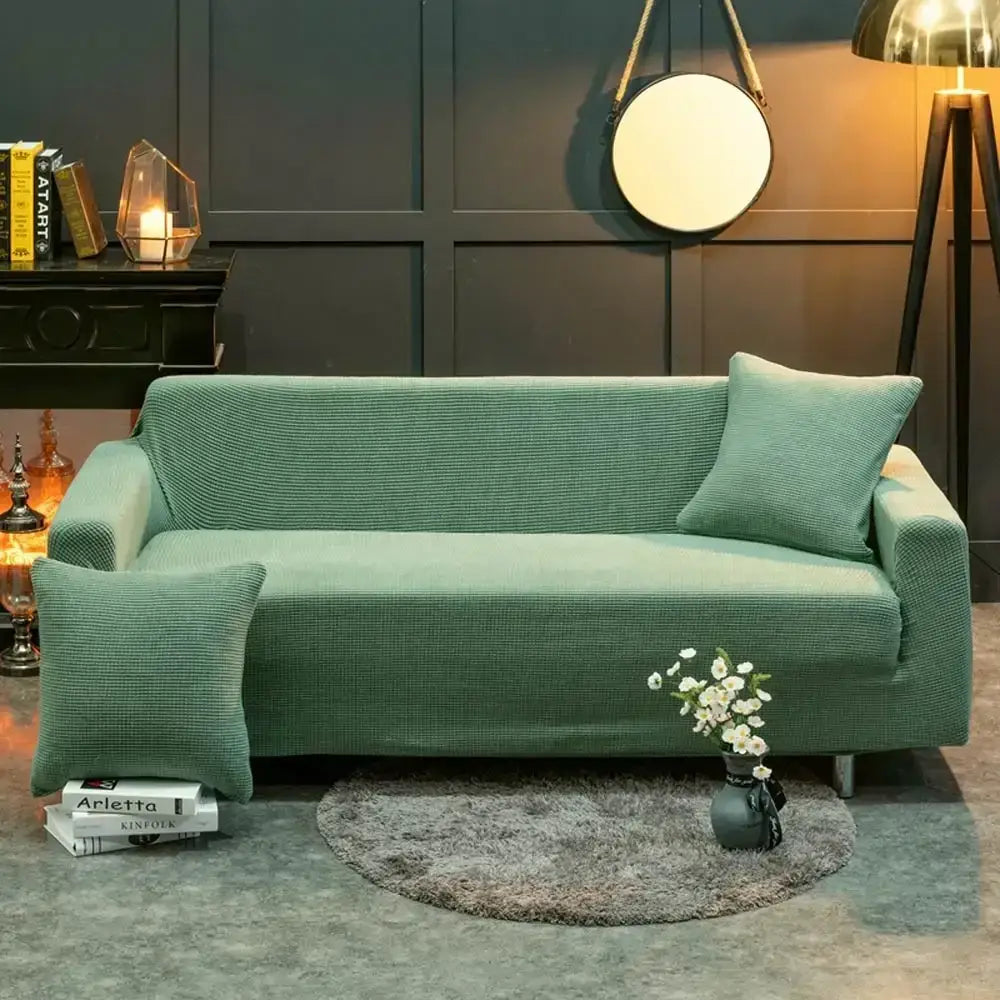 Beige textured quilted sofa cover with pillows for living room
