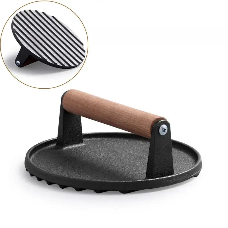 Black and light brown cast iron burger press kitchen meat tool