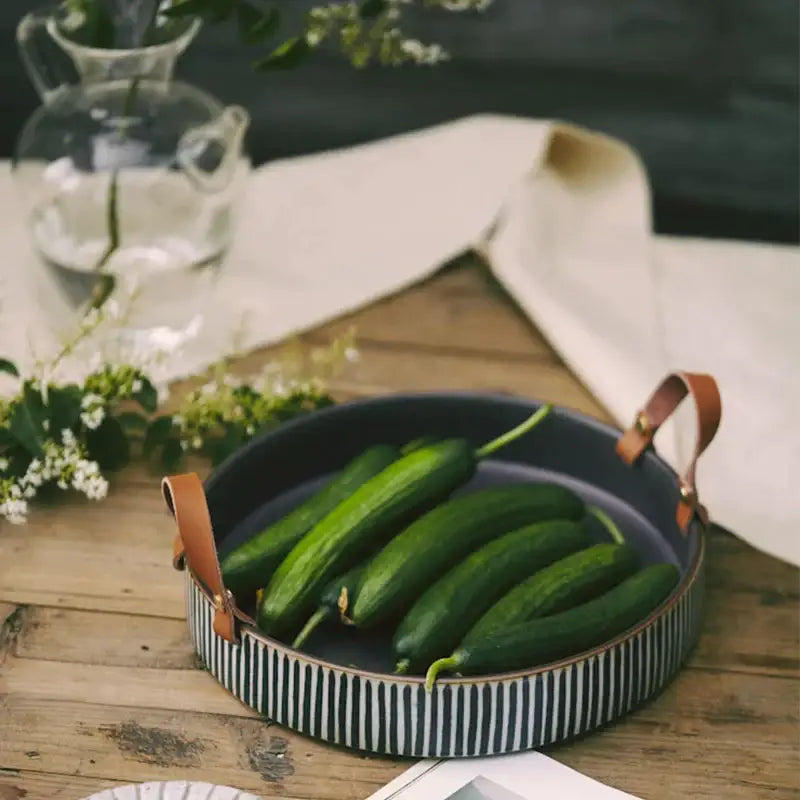 Black and white striped porcelain bowl with leather handle dining room
