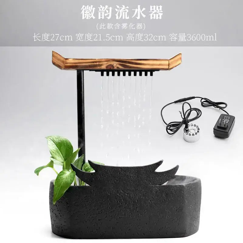 Black ceramic water fountain with wood roof living room decor