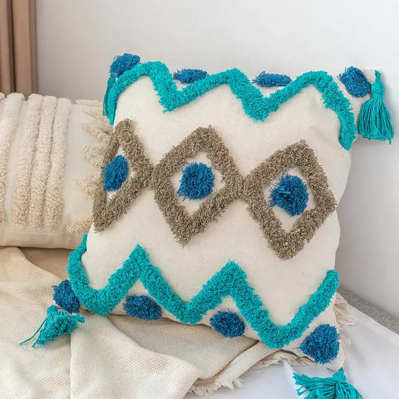 Boho square pillowcase with white zigzag and teal tassels living room