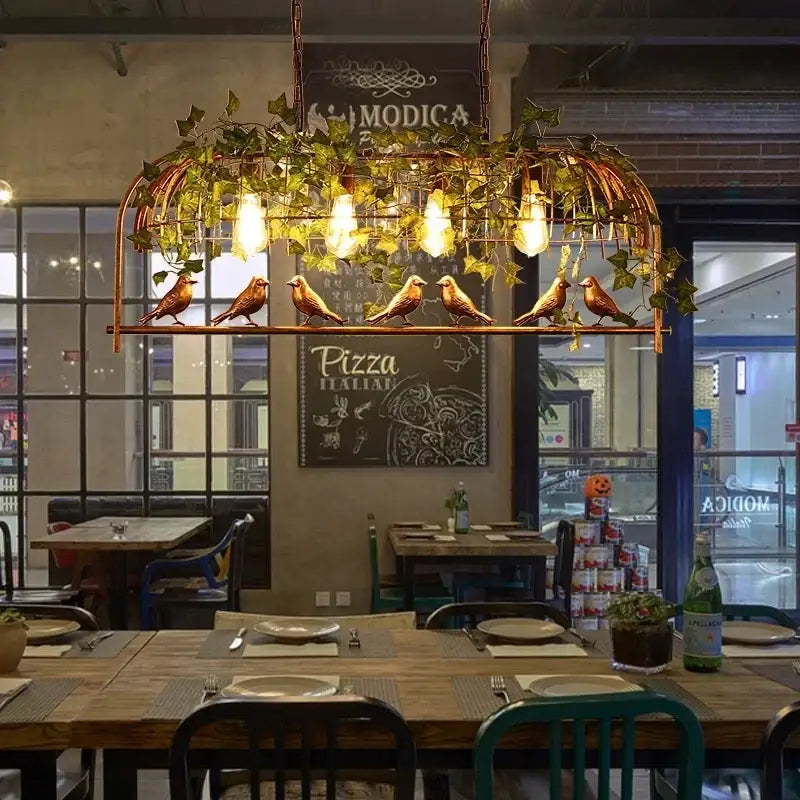 Bronze birdcage pendant lights with garland for dining room