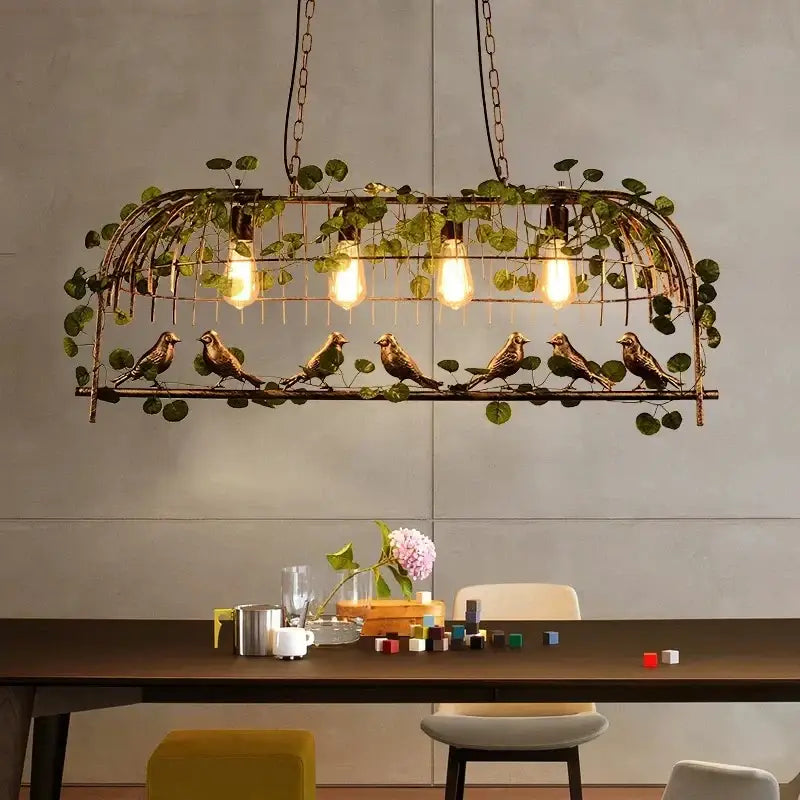 Bronze birdcage pendant lights with garland for dining room
