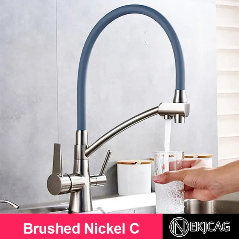 Brushed gold and black kitchen faucet with dual handles and filter