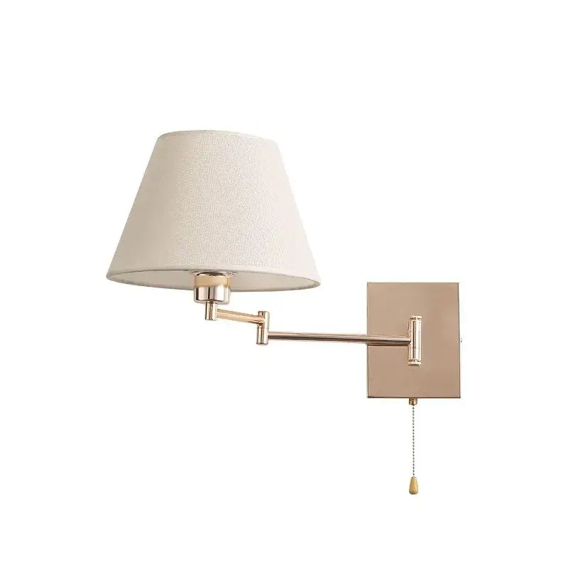 Brushed nickel adjustable rocker arm wall lamp with cream shade bedroom