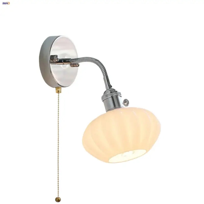 Chrome adjustable arm wall lamp with ribbed glass shade – bedroom