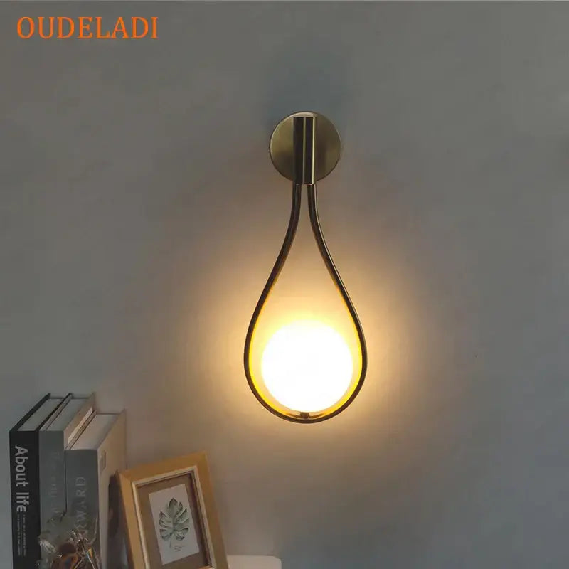 Chrome teardrop wall sconce with white glass ball for bedroom