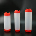 Clear red white & yellow tomato squeeze bottle kitchen set