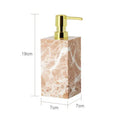 Coral pink marble bathroom accessories set with gold accents