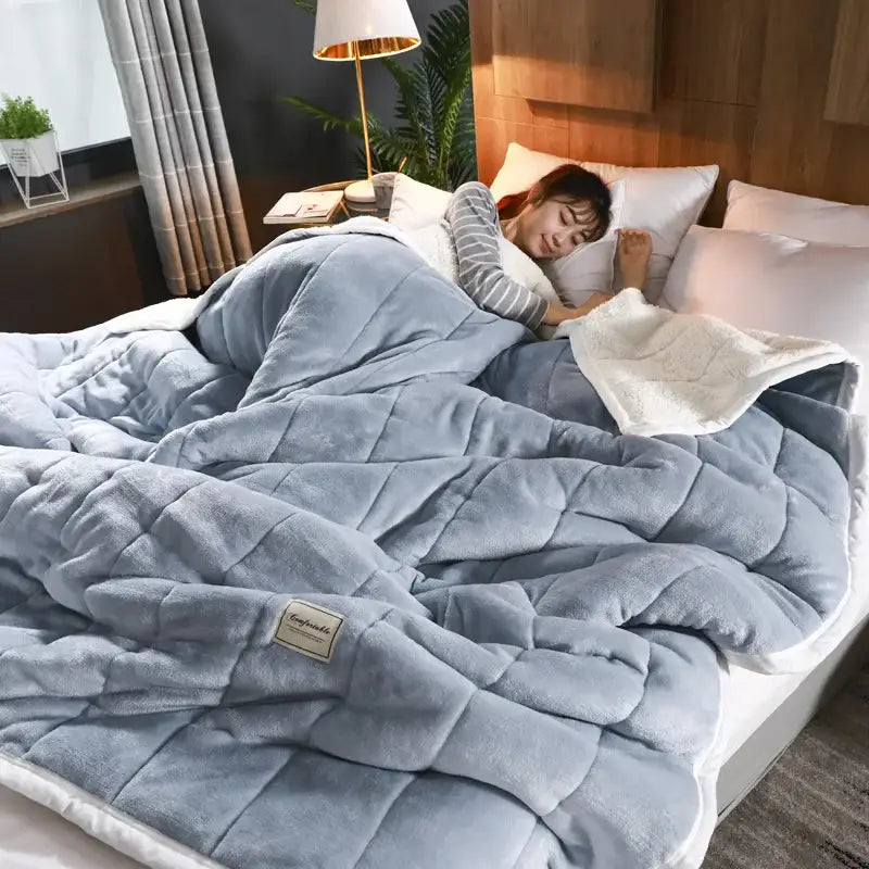 Cozy coral fleece blue and white quilted blanket for bedroom