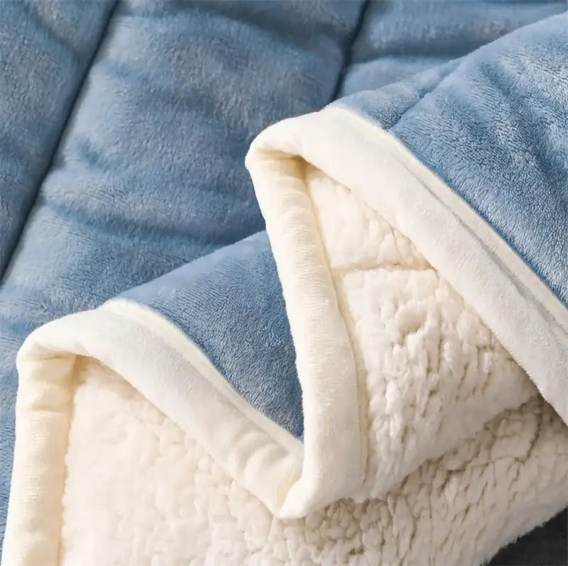 Cozy coral fleece blue and white quilted blanket for bedroom
