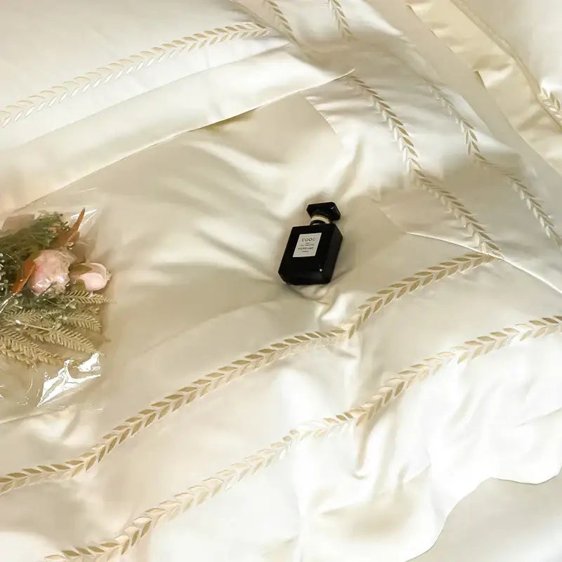 Cream embroidered ice silk bedding set for bedroom