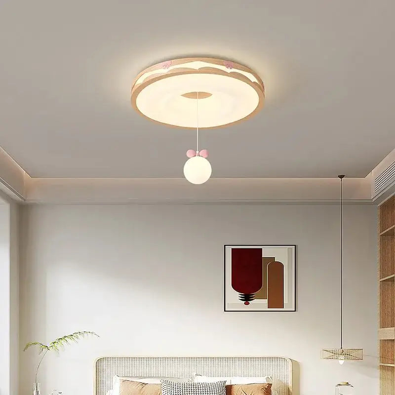 Cream wind walnut round bedroom light with pink bow hanging bulb