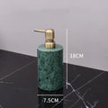 Dark green marble bathroom accessory set with gold accents