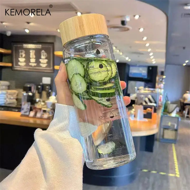 Modern glass water bottle with wood lid and tea filter kitchen accessory