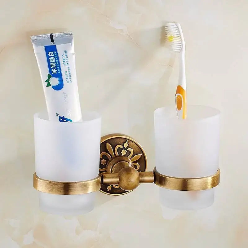 Antique brass floral bath hardware set with towel rack and toilet brush
