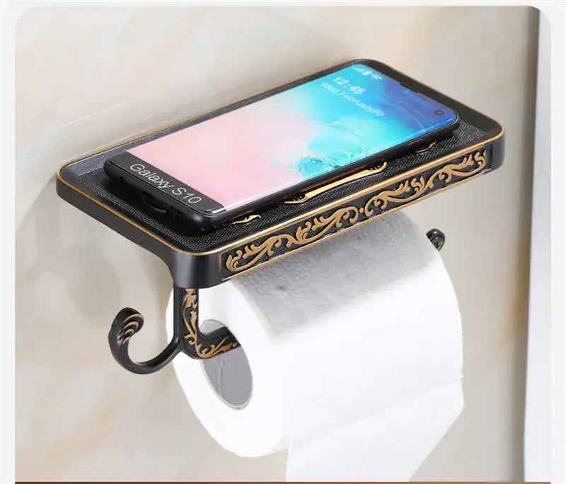 Antique brass ornate toilet paper holder with phone shelf bathroom