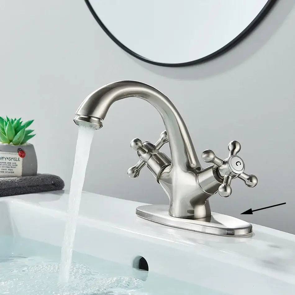 Antique brass basin faucet with ornate cross handles for bathroom