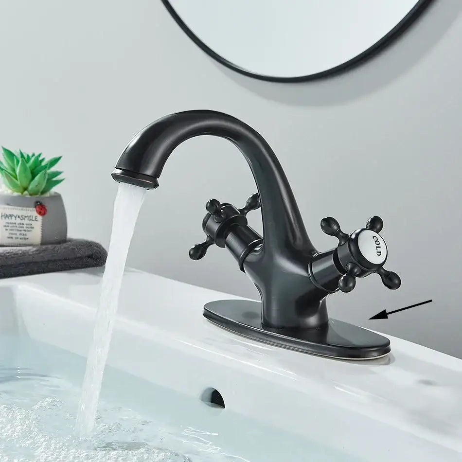 Antique brass basin faucet with ornate cross handles for bathroom