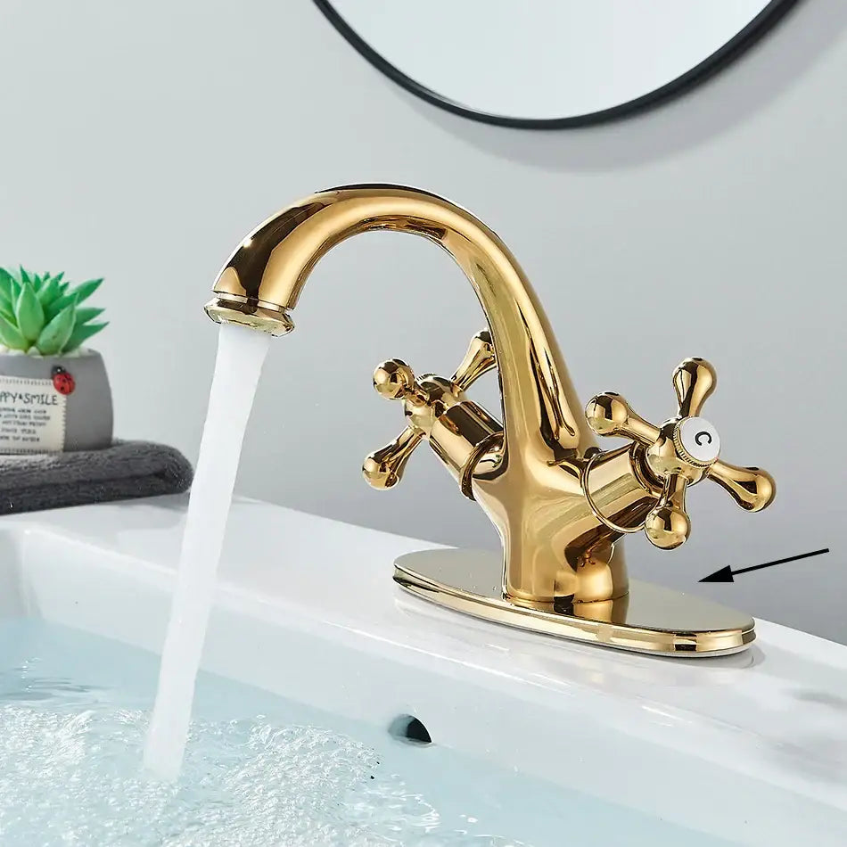 Antique brass basin faucet with ornate cross handles for bathroom