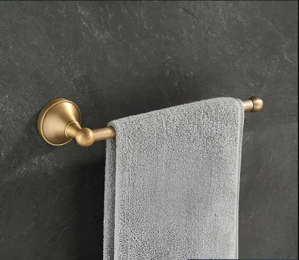Antique brass bathroom accessory set with wall shelf