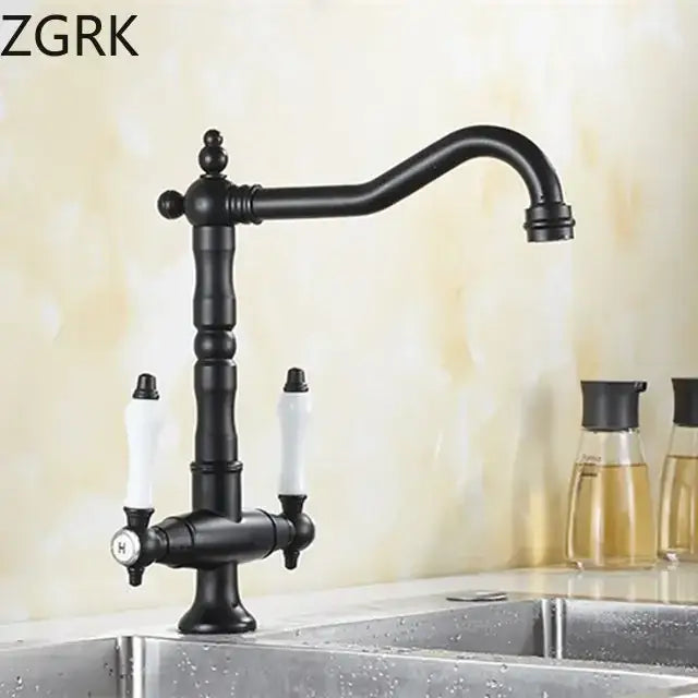 Antique brass kitchen faucet with ceramic handles and curved spout