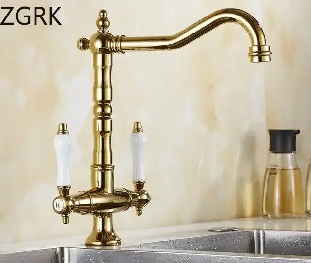 Antique brass kitchen faucet with ceramic handles and curved spout