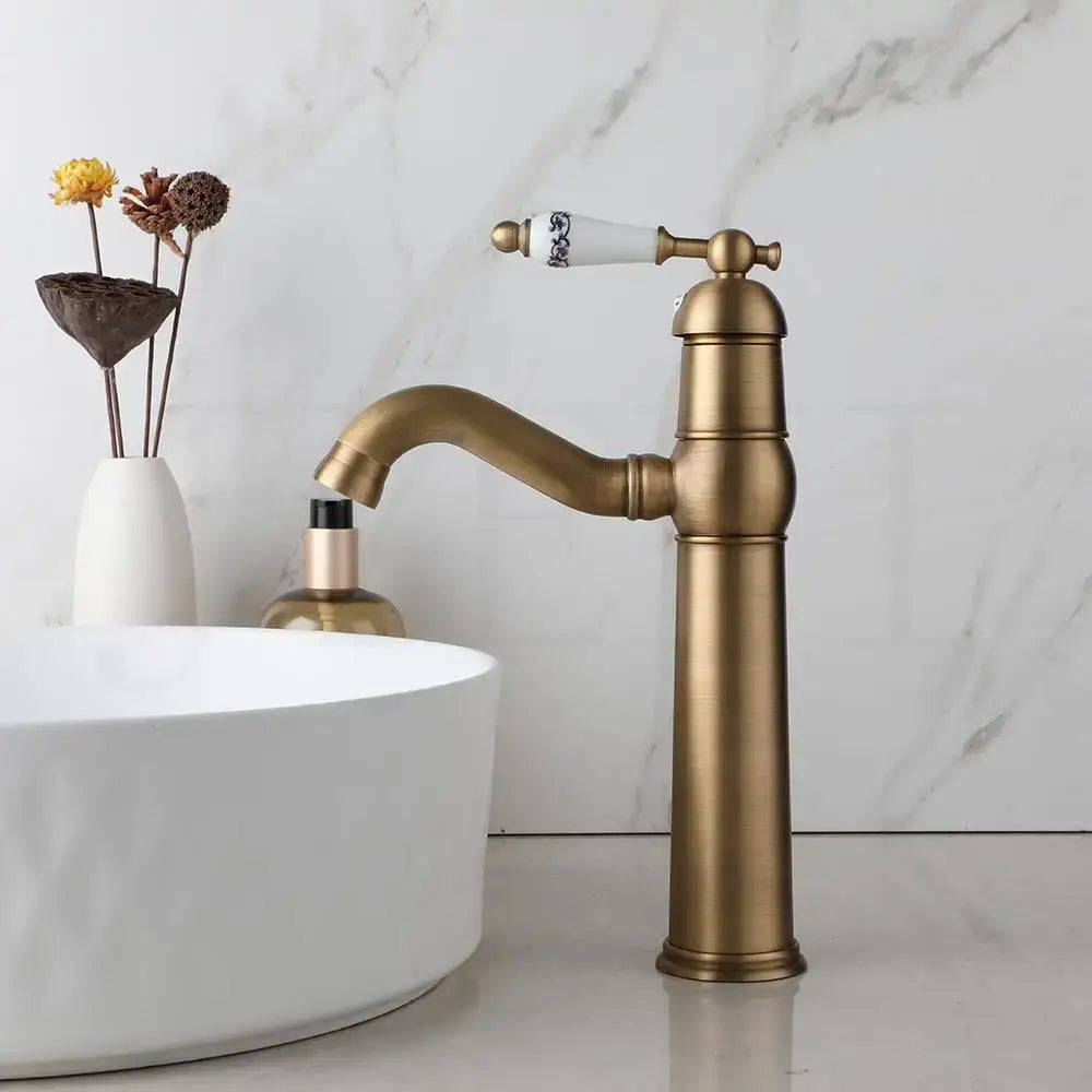 Antique brass swivel bathroom faucet with crystal handle