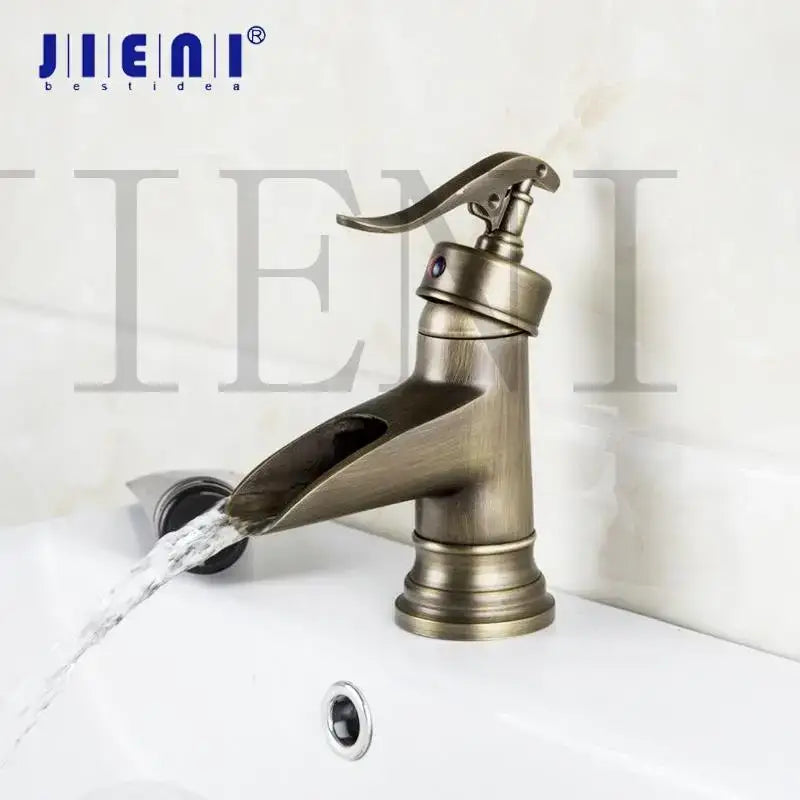 Antique brass waterfall basin faucet with art handle for bathroom