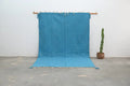 Handmade traditional azilal rug turquoise living room decor with tassels