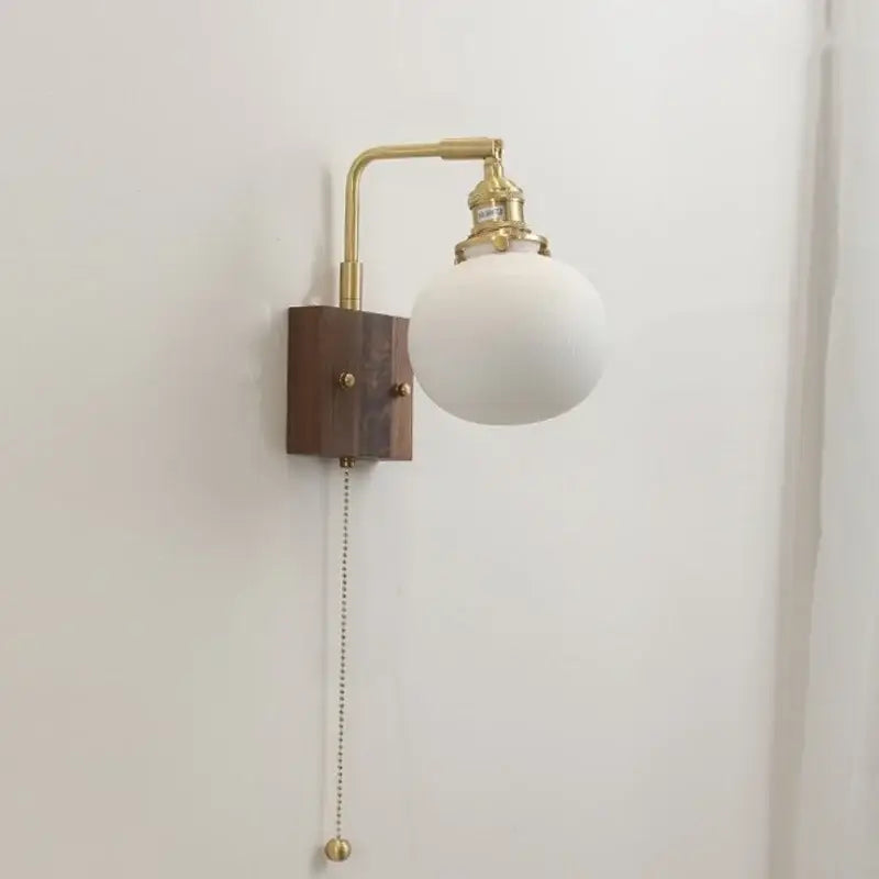 Brass and wood globe wall sconce bedroom light fixture