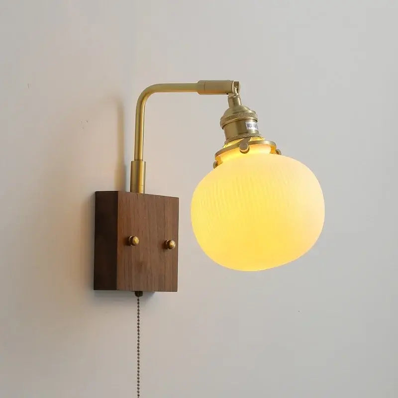 Brass and wood globe wall sconce bedroom light fixture