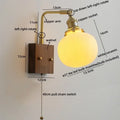 Brass and wood globe wall sconce bedroom light fixture