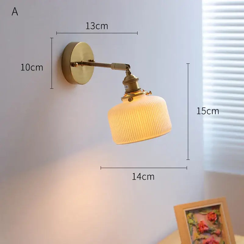 Ribbed white glass and brass ceramic wall sconce for bedroom lighting
