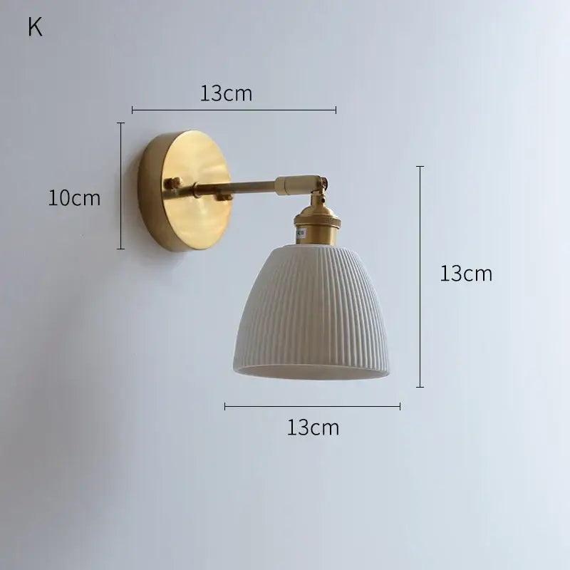Ribbed white glass and brass ceramic wall sconce for bedroom lighting