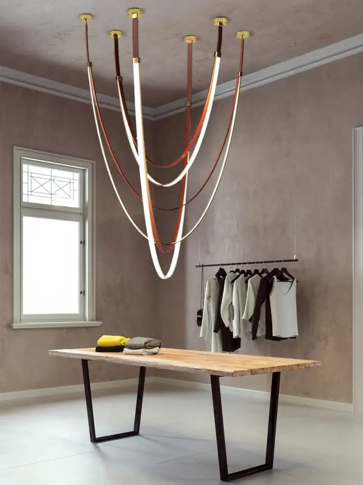 Minimalist silver flexible leather belt wall lamp bedroom light